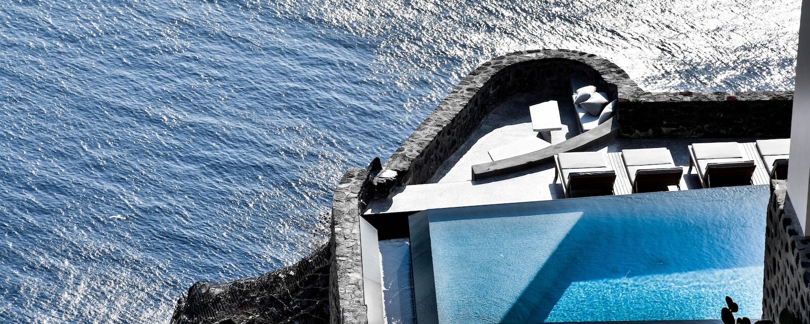 gray and white concrete building over body of water