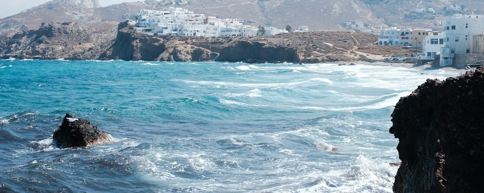 blue ocean near rocky island