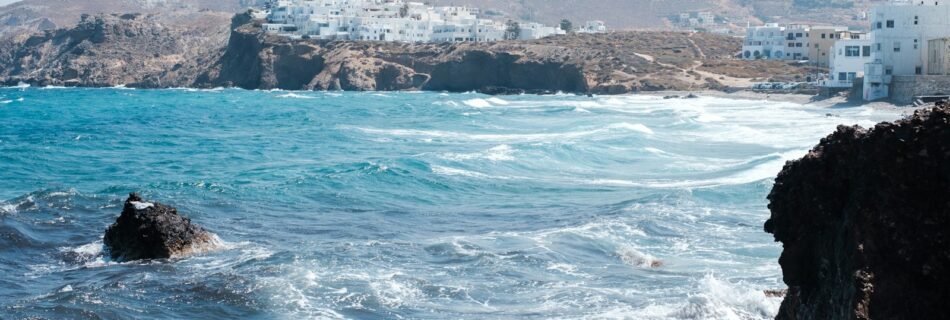 blue ocean near rocky island