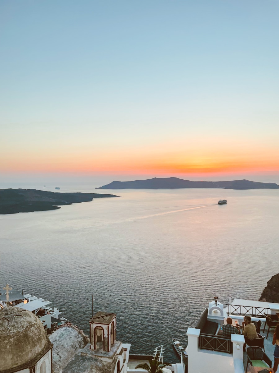 white boat on sea during sunset